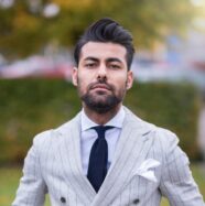 man in white and black pinstripe suit jacket